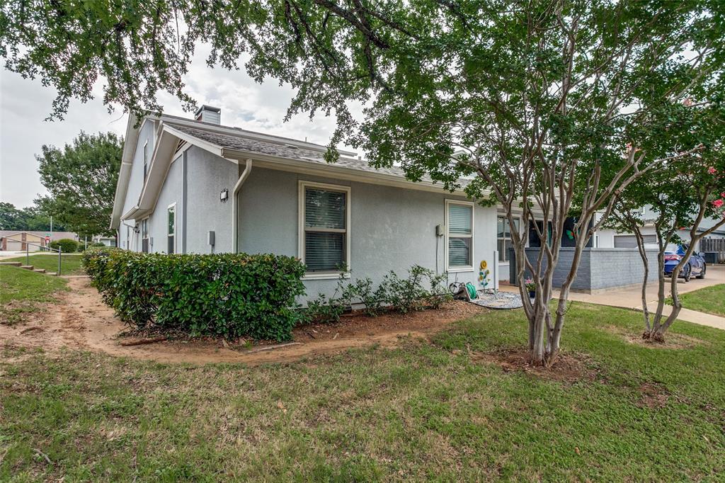 649 Timberline Drive Hurst, TX 76053 - Photo 29 of 29 a front view of a house with garden