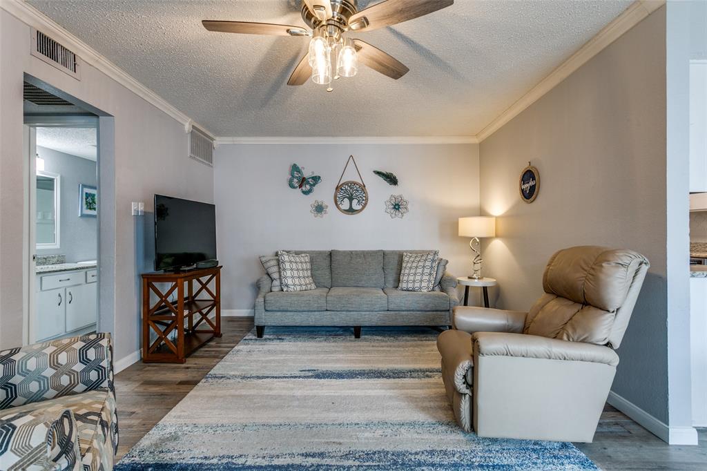 649 Timberline Drive Hurst, TX 76053 - Photo 5 of 29 a living room with furniture and a flat screen tv
