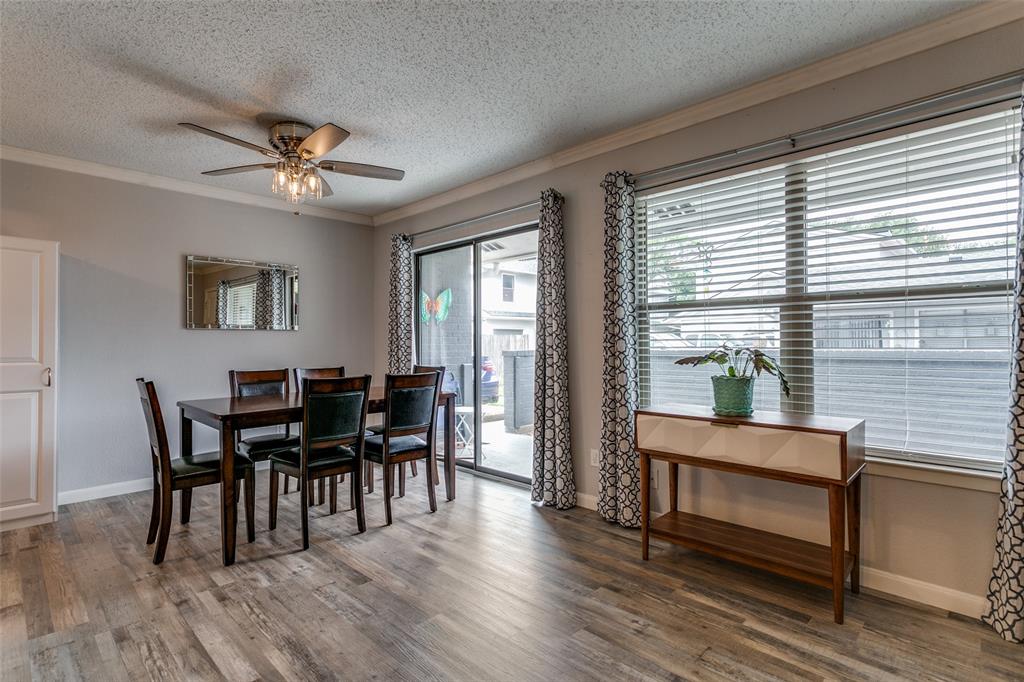 649 Timberline Drive Hurst, TX 76053 - Photo 9 of 29 a view of a dining room with furniture and wooden floor
