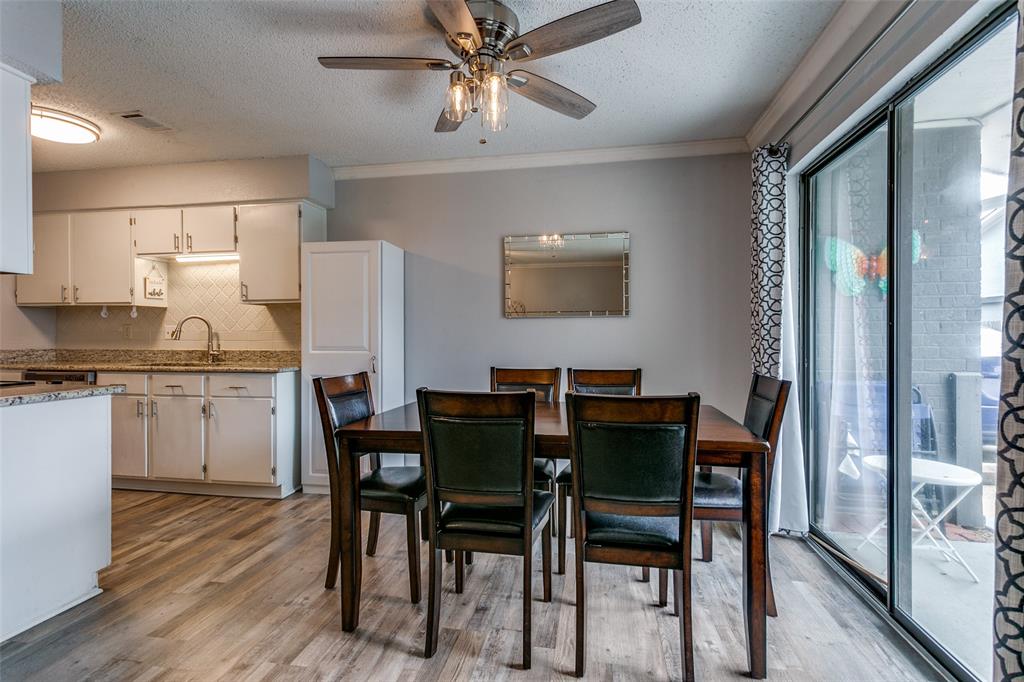 649 Timberline Drive Hurst, TX 76053 - Photo 10 of 29 a view of a dining room with furniture and wooden floor
