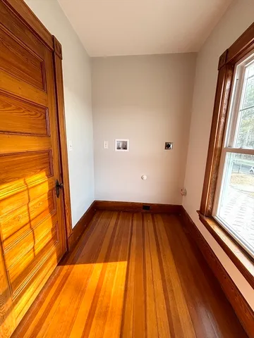 a view of kitchen with wooden floor and window