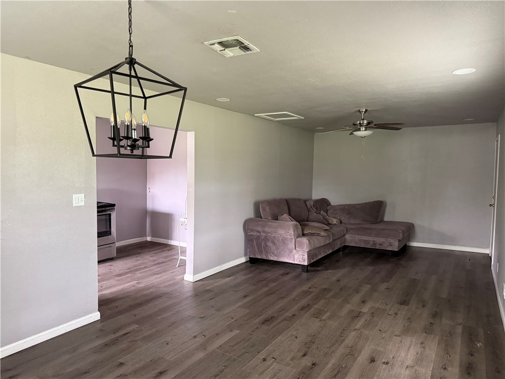 9047 County Road 471 Mathis, TX 78368 - Photo 12 of 21 a living room with furniture and a wooden floor