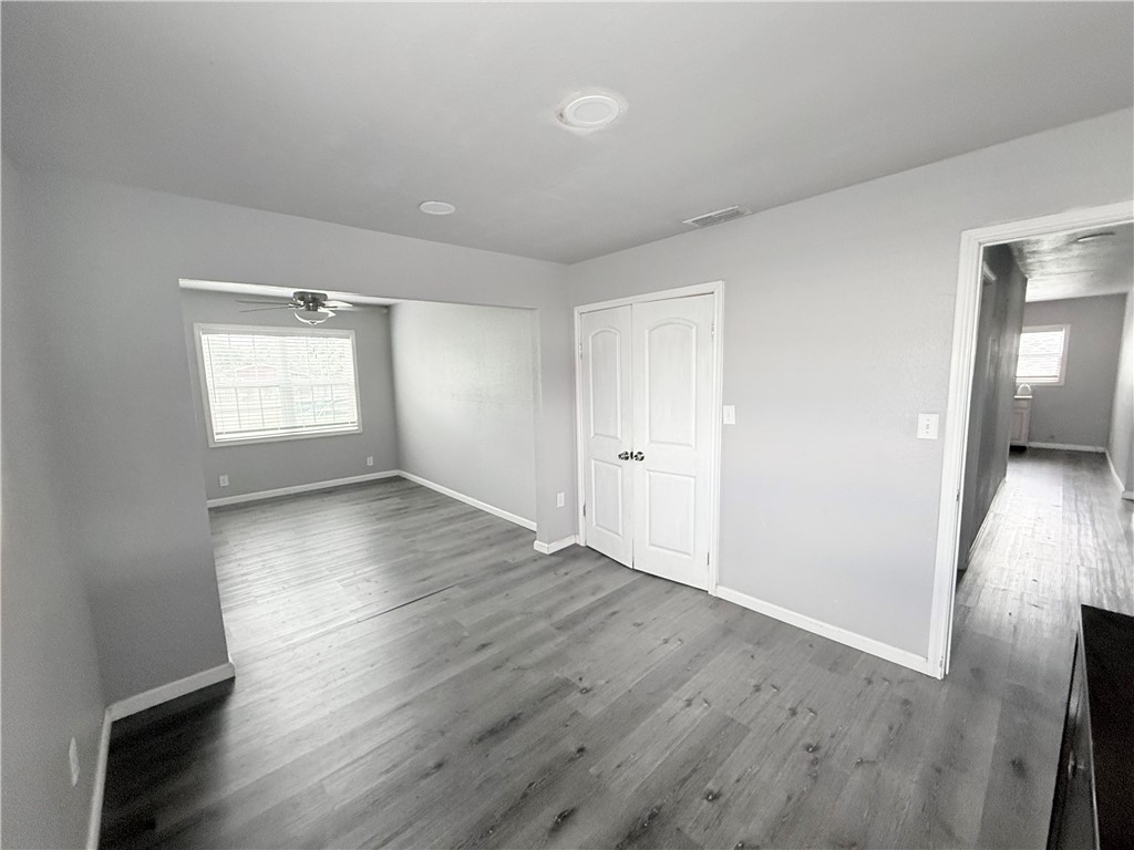 9047 County Road 471 Mathis, TX 78368 - Photo 15 of 21 wooden floor in an empty room with a window