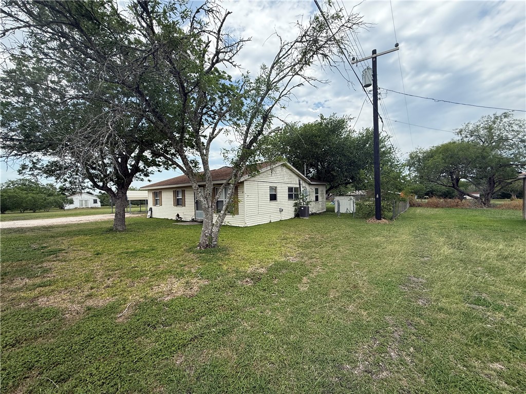 9047 County Road 471 Mathis, TX 78368 - Photo 3 of 21 a view of a house with a yard