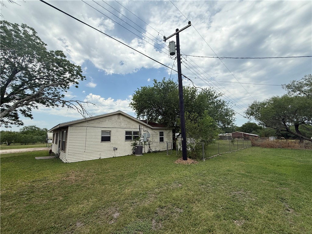9047 County Road 471 Mathis, TX 78368 - Photo 4 of 21 a house view with a garden space