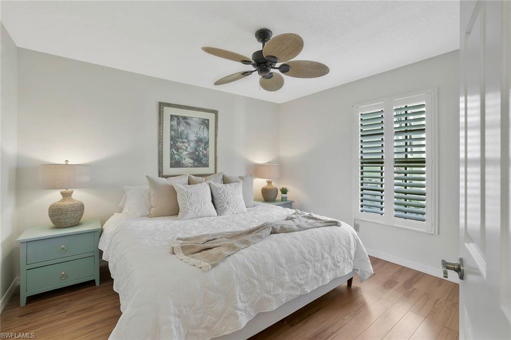 601 Augusta Boulevard, Unit 6014 Naples, FL 34113 - Photo 15 of 31 a bedroom with a bed and a window
