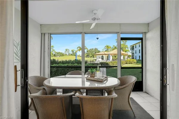a view of a dining room with furniture window and outside view