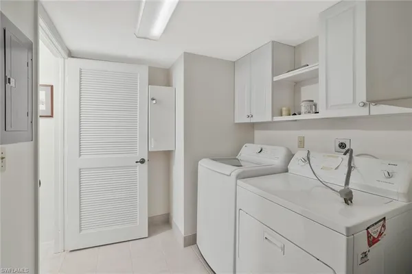 a view of cabinets and washer dryer