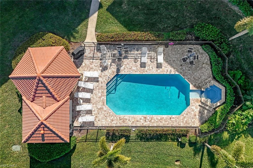601 Augusta Boulevard, Unit 6014 Naples, FL 34113 - Photo 23 of 31 an aerial view of a house with backyard space and swimming pool