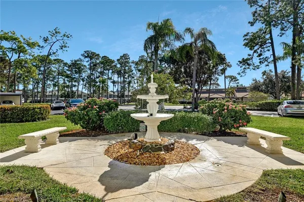 a view of a garden with a fountain