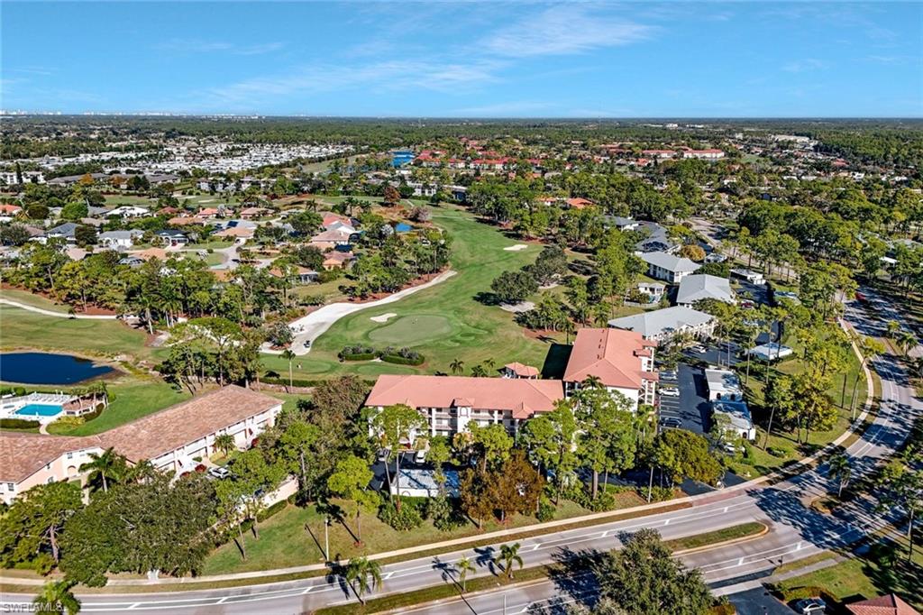 601 Augusta Boulevard, Unit 6014 Naples, FL 34113 - Photo 29 of 31 an aerial view of residential houses with outdoor space