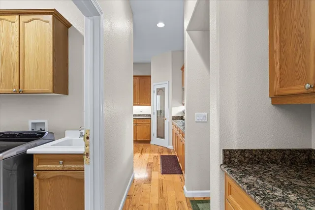 a utility room with sink dryer and washer