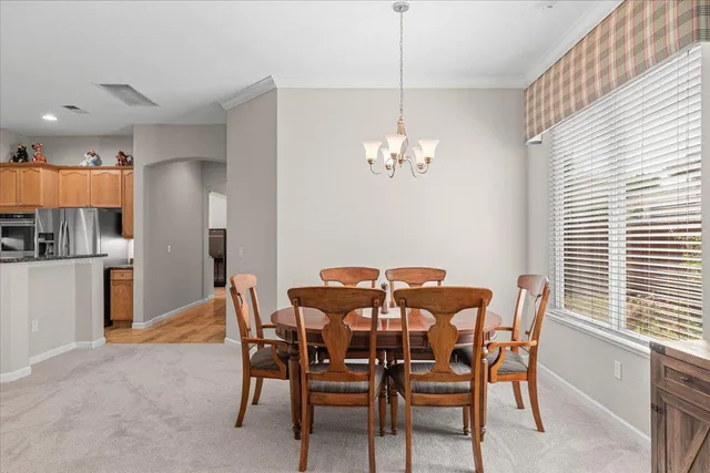 a kitchen with stainless steel appliances a refrigerator and microwave