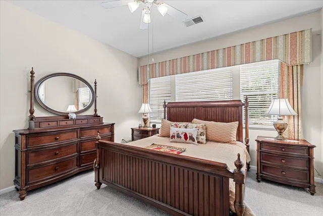 a bed room with a bed and a lamp