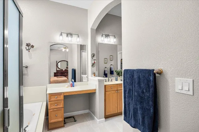 a bathroom with a bathtub and a sink