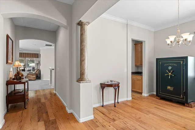 a view of a livingroom with furniture window and wooden floor