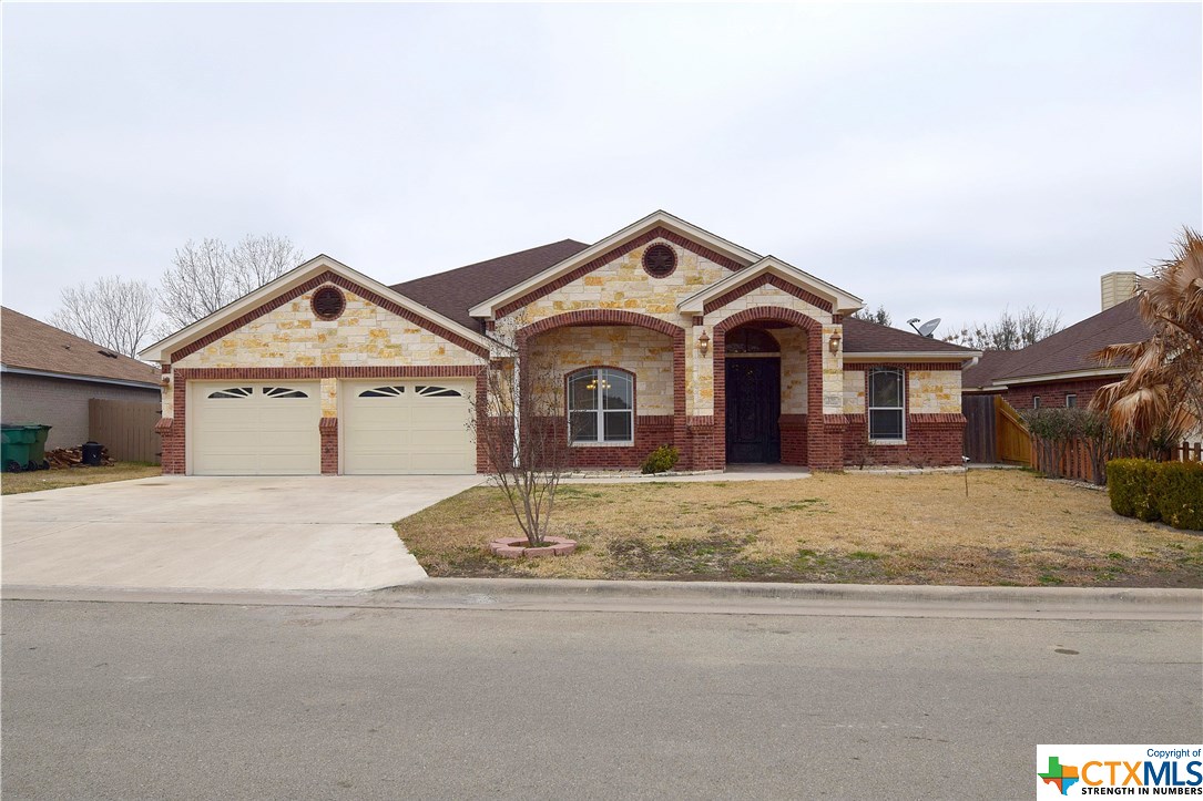 a view of front of house with a street