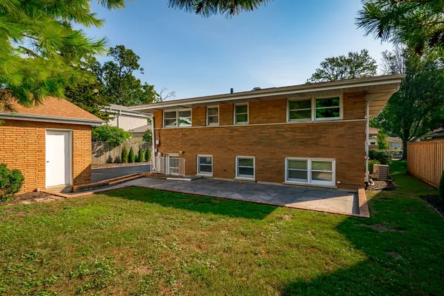 a front view of a house with a yard and porch