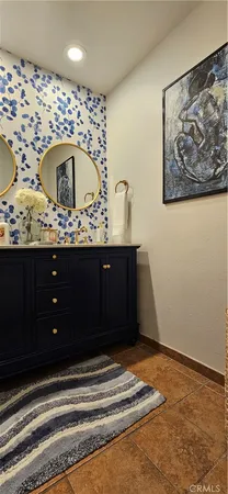 a bedroom with a bed and lamp