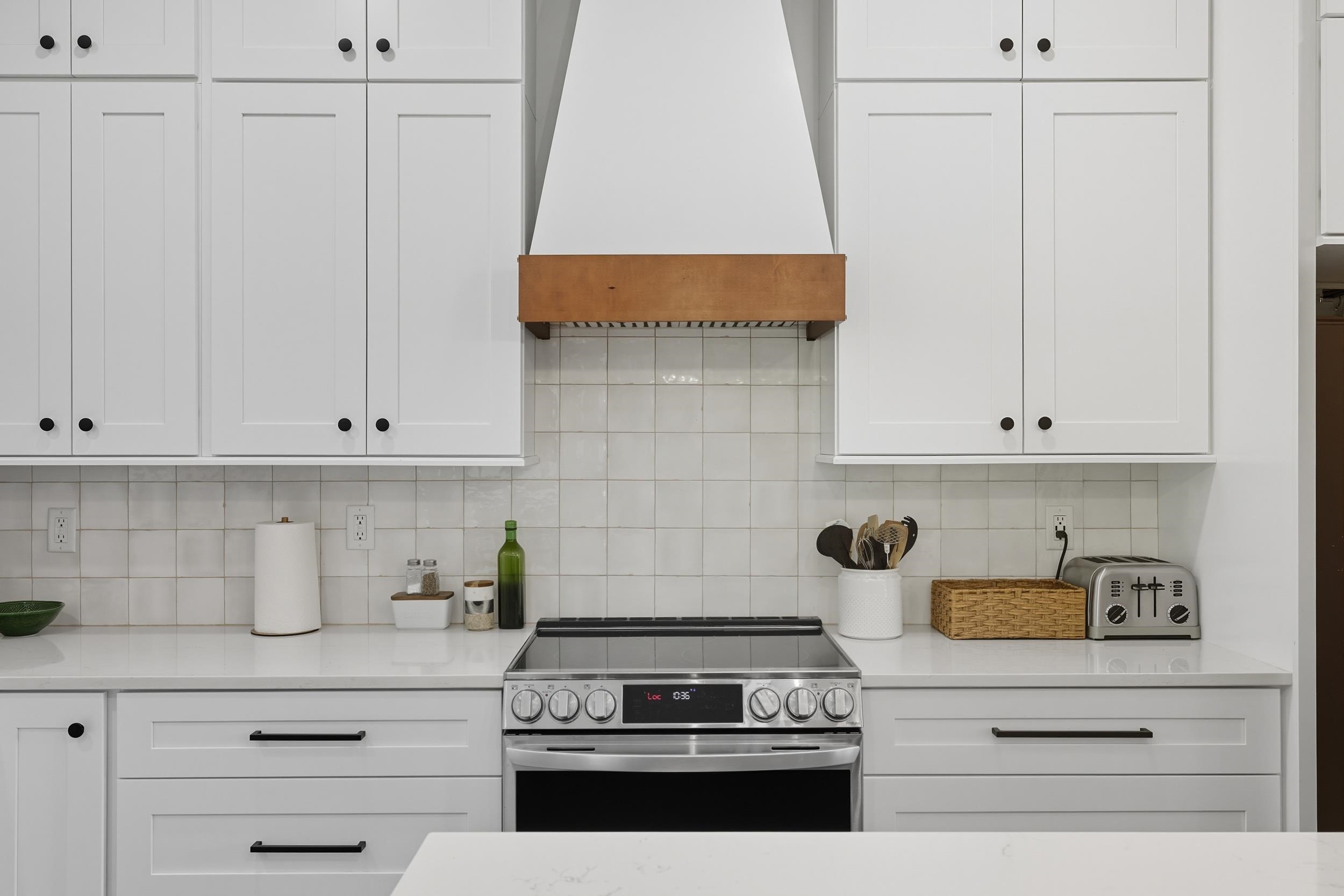 2430 Fadley Road Bridgewater, VA 22812 - Photo 11 of 66 a kitchen with white cabinets and a stove