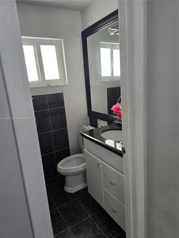 a bathroom with a shower and a toilet