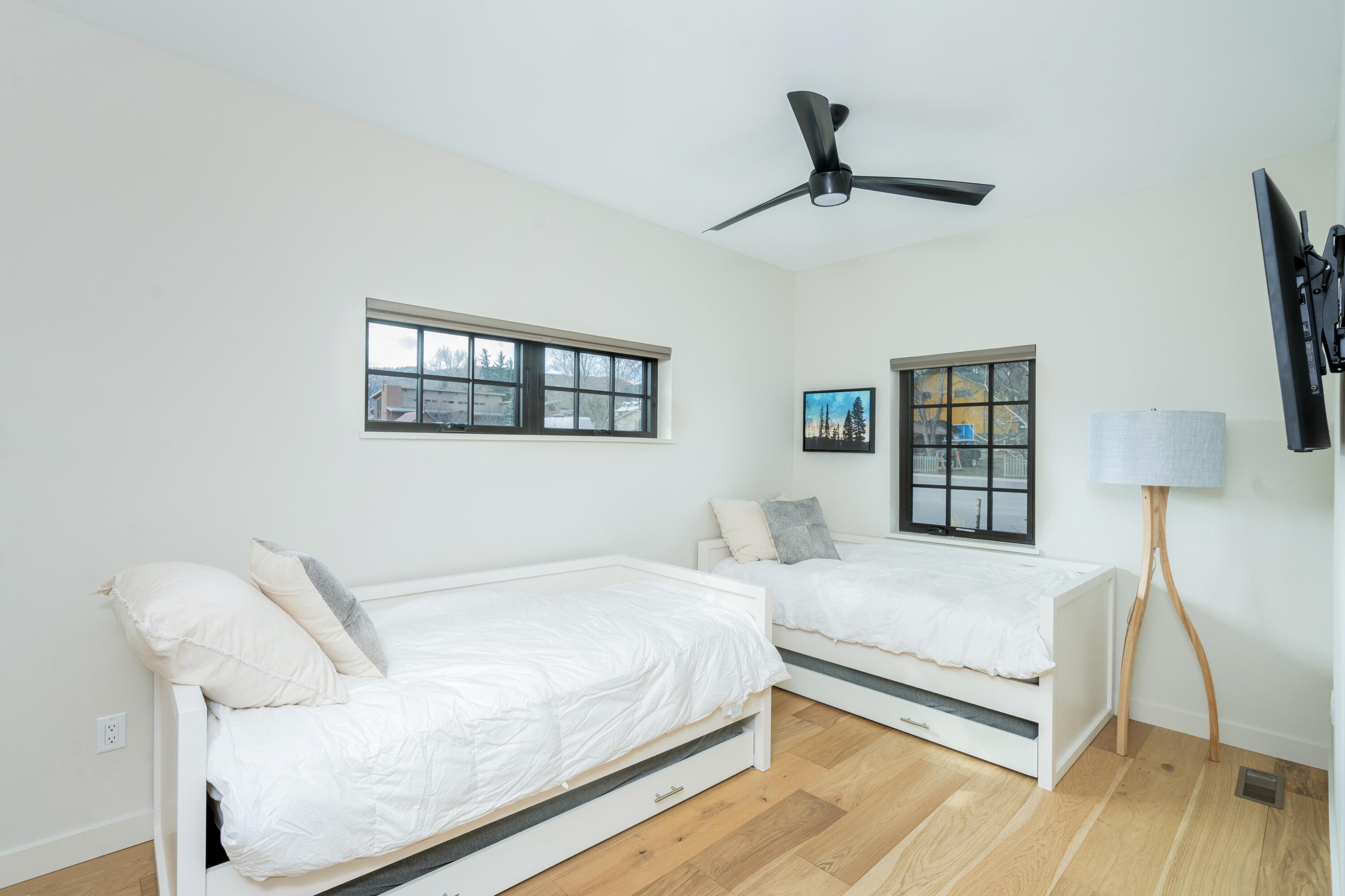 388 North Lena Street, Unit 5C Ridgway, CO 81432 - Photo 13 of 27 a bedroom with a bed and a chandelier