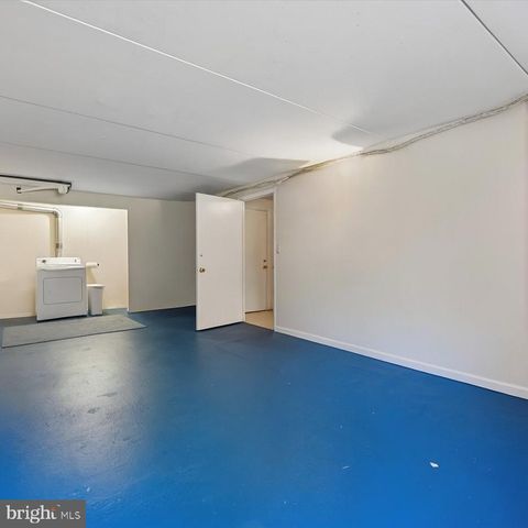 a view of an empty room and wooden floor