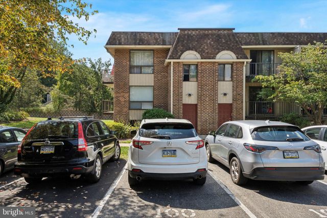 a view of a car parked in front of a house
