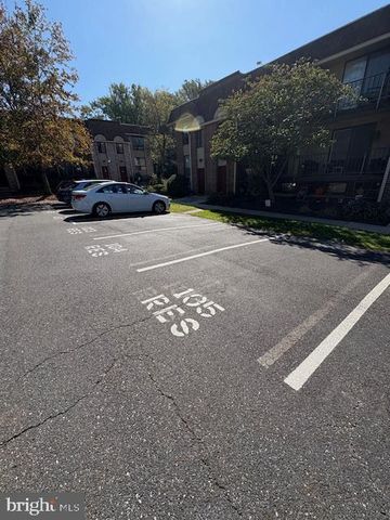 a view of street with parked cars