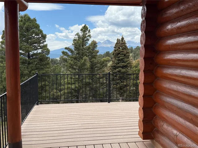 a kitchen with a table chairs refrigerator and cabinets