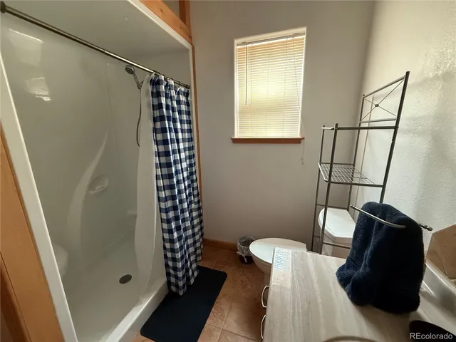 a living room with furniture fireplace and flat screen tv