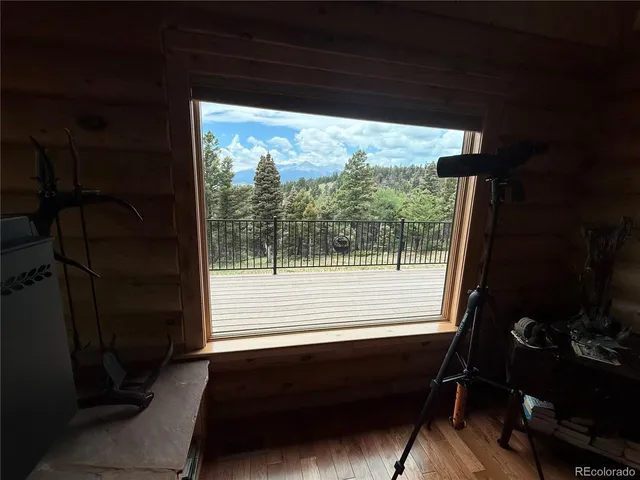 a view of balcony with wooden floor