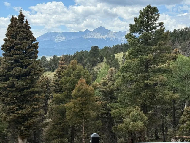 a view of a two chairs on the roof deck