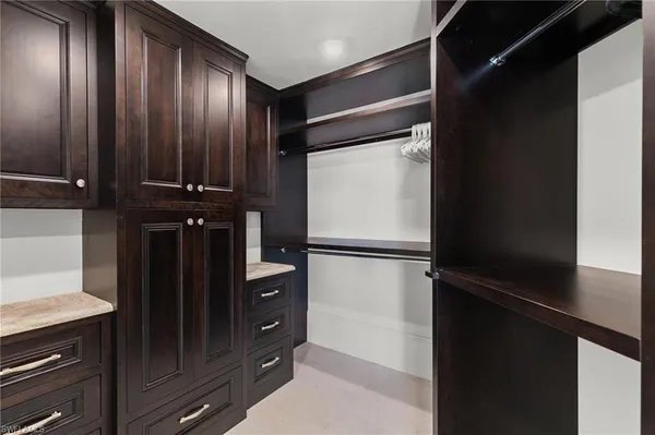 an aerial view of a house with a garden and lake view