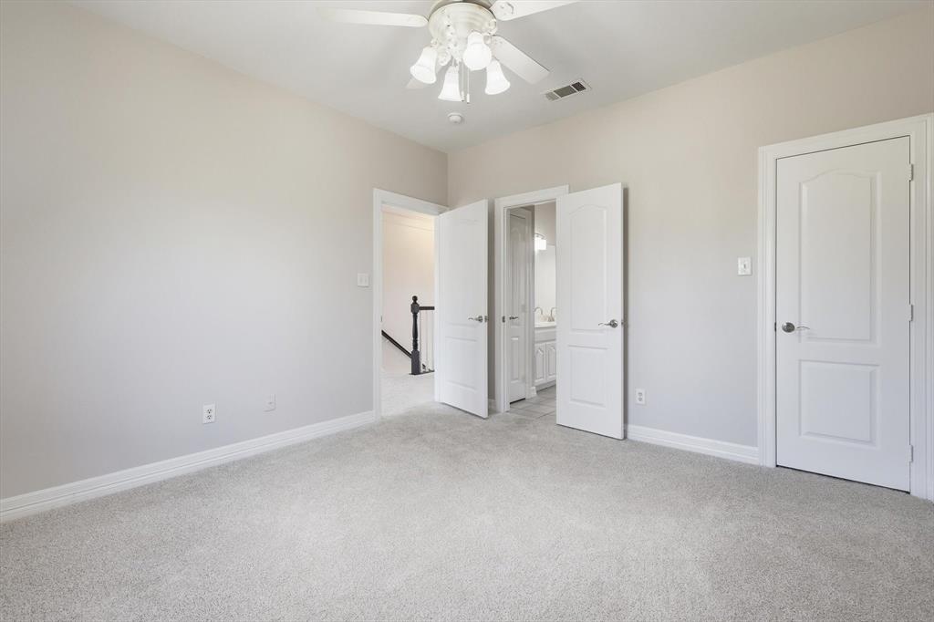 3521 Bay Ridge Drive Little Elm, TX 75068 - Photo 18 of 38 a view of an empty room with a chandelier
