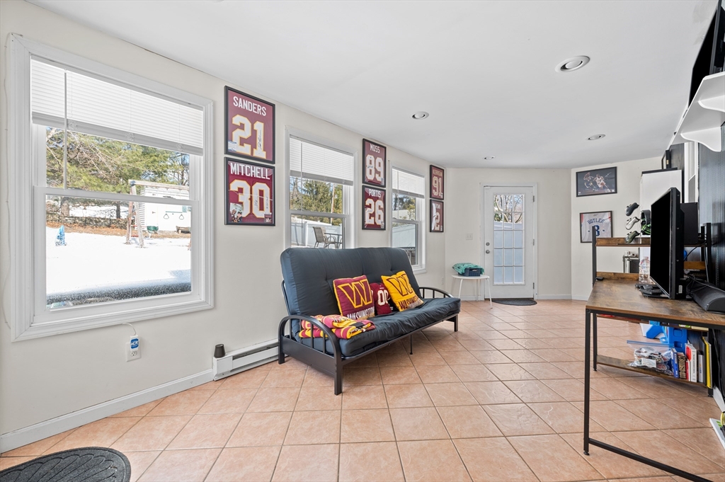 28 Barnard Road Worcester, MA 01605 - Photo 14 of 29 a living room with furniture and a flat screen tv