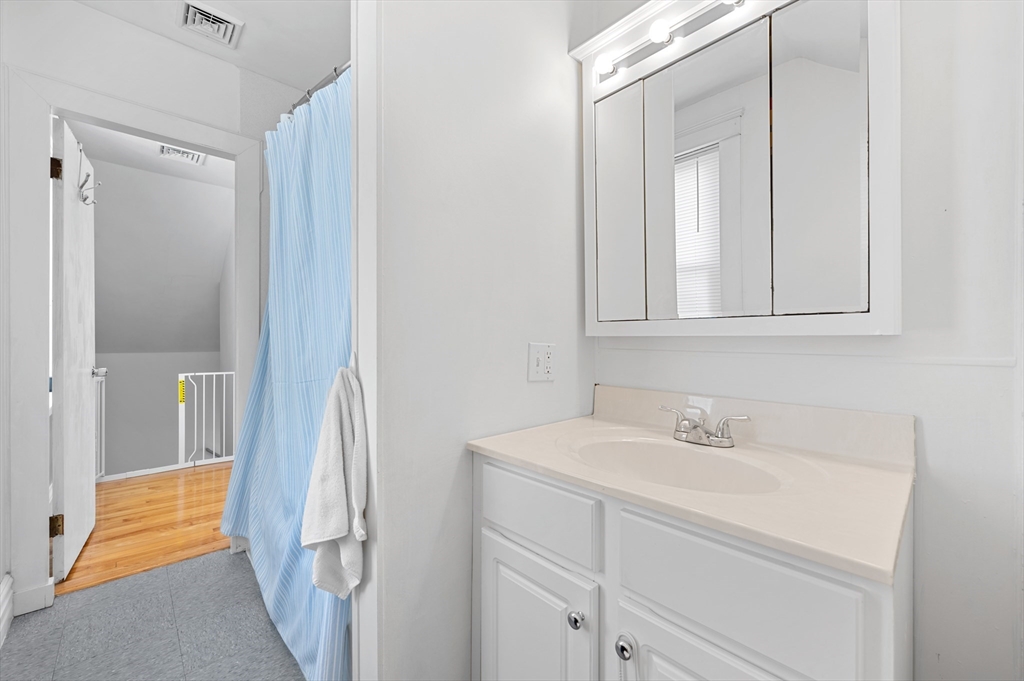 28 Barnard Road Worcester, MA 01605 - Photo 17 of 29 a bathroom with a sink and a mirror