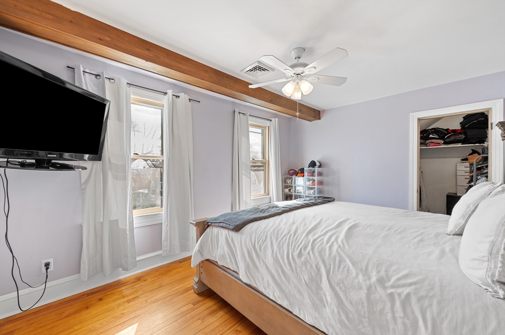 28 Barnard Road Worcester, MA 01605 - Photo 19 of 29 a bedroom with a bed and a flat screen tv