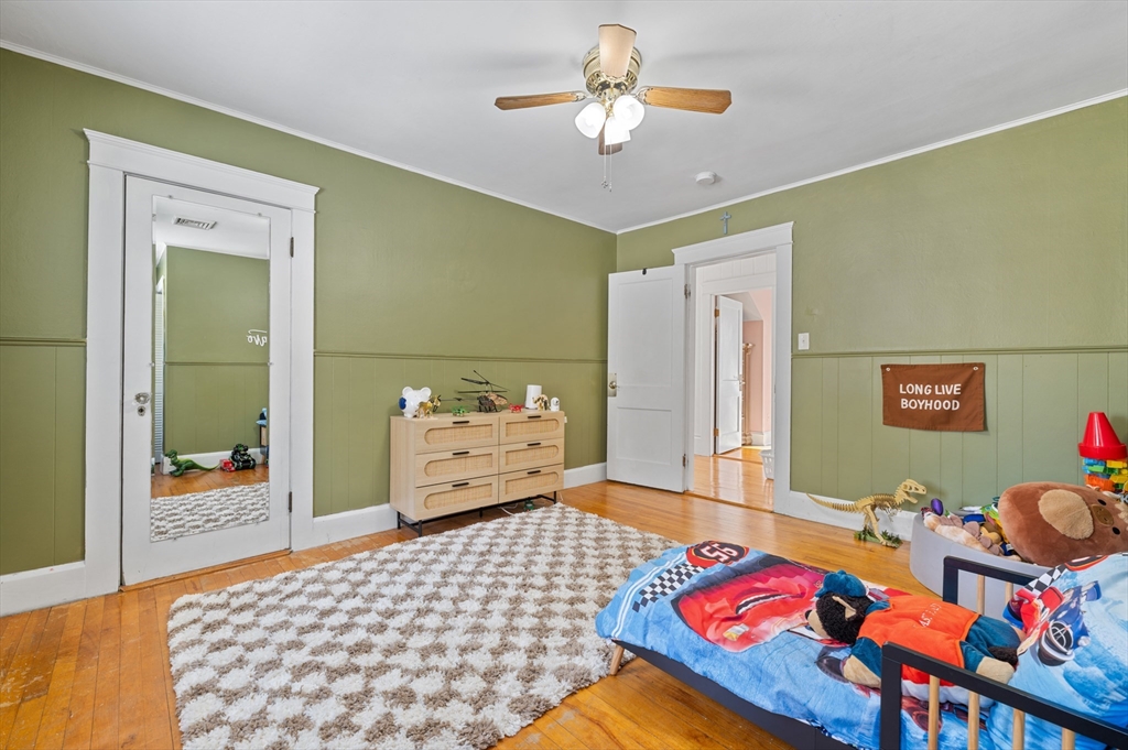 28 Barnard Road Worcester, MA 01605 - Photo 22 of 29 a bedroom with a bed and wooden floor