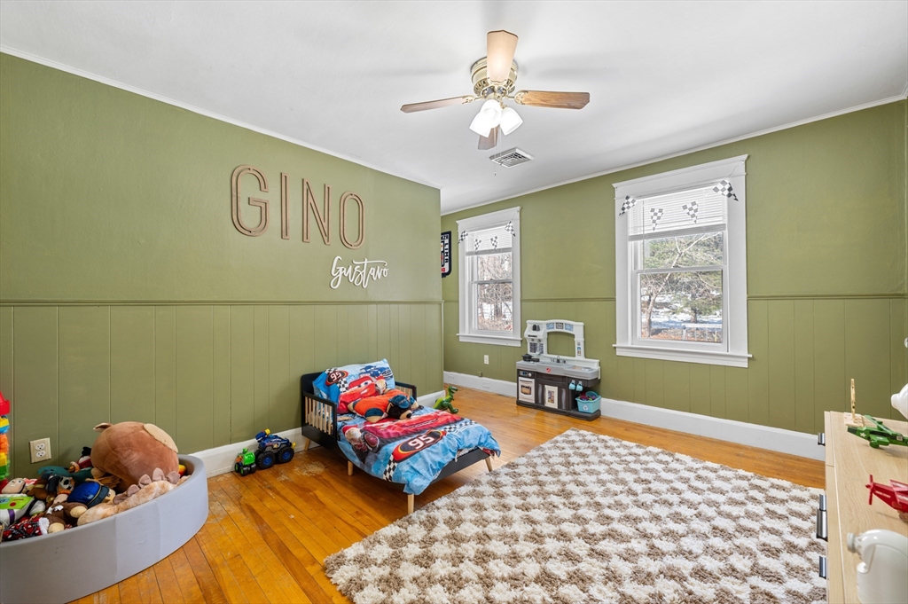 28 Barnard Road Worcester, MA 01605 - Photo 24 of 29 a bedroom with a bed and wooden floor