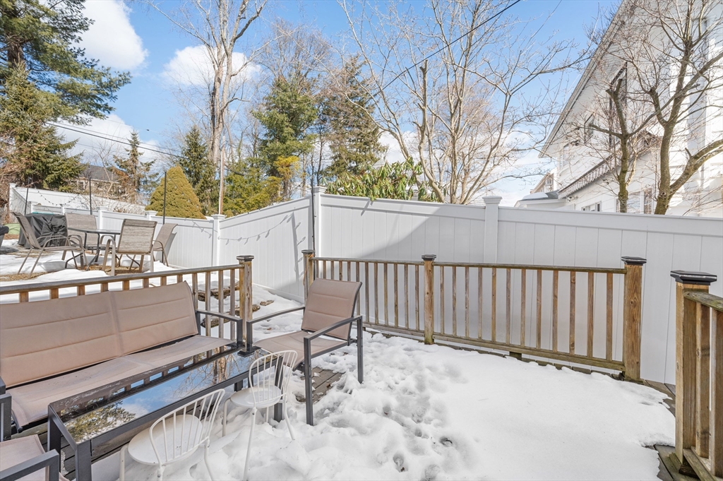 28 Barnard Road Worcester, MA 01605 - Photo 26 of 29 a view of backyard with a patio and wooden fence
