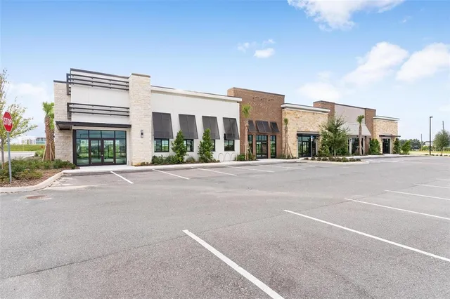 a view of street with a buildings in the background