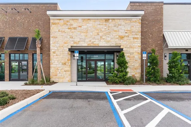 a view of a brick house with a large windows