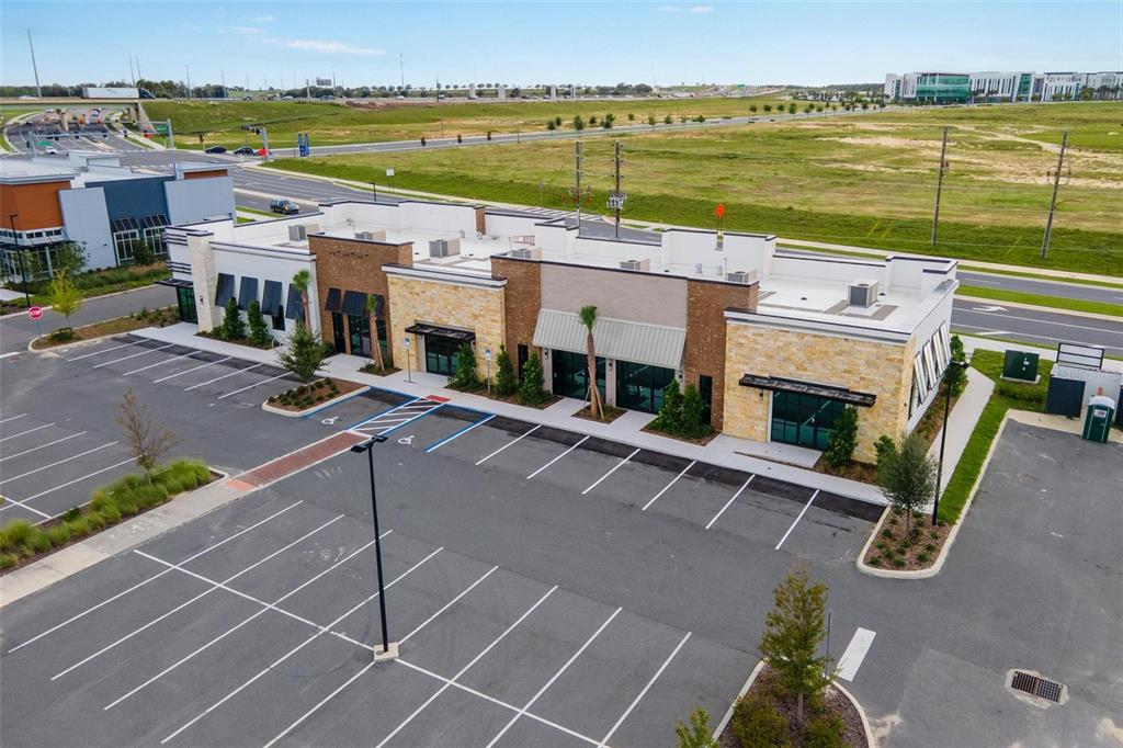 7159 Avalon Road, Unit 6 Winter Garden, FL 34787 - Photo 6 of 21 a view of a patio with lawn chairs floor to ceiling window and an outdoor view