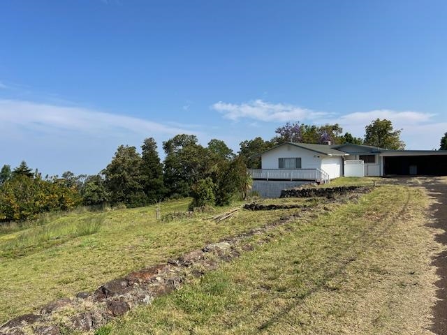 221 Upper Kimo Drive Kula, HI 96790 - Photo 1 of 21 a front view of a house with a yard