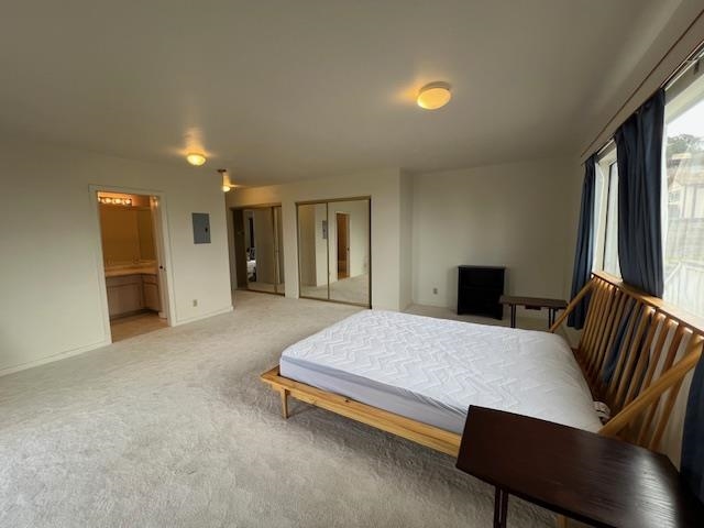 221 Upper Kimo Drive Kula, HI 96790 - Photo 12 of 21 a spacious bedroom with a bed and a desk