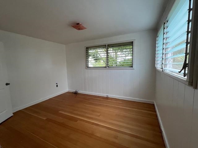 221 Upper Kimo Drive Kula, HI 96790 - Photo 15 of 21 a view of an empty room with wooden floor and a window