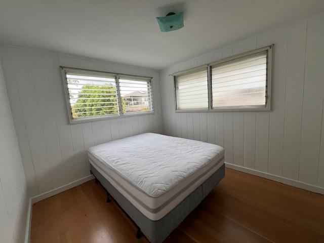 221 Upper Kimo Drive Kula, HI 96790 - Photo 19 of 21 a bed sitting in a bedroom next to a window