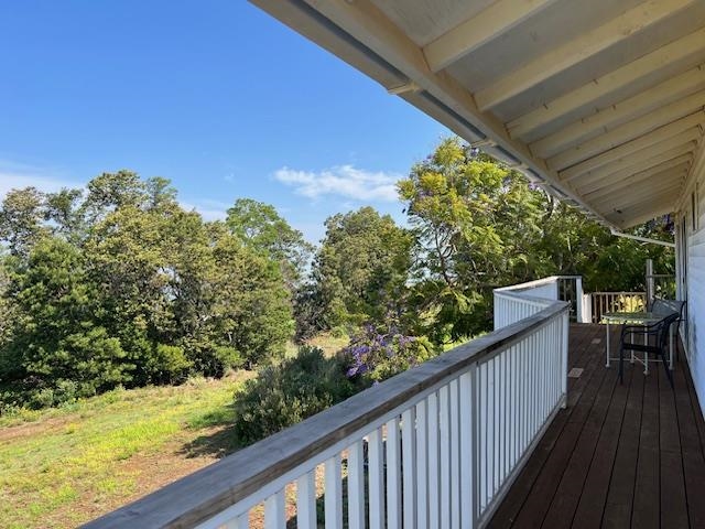 221 Upper Kimo Drive Kula, HI 96790 - Photo 20 of 21 a view of a balcony with wooden floor and outdoor seating