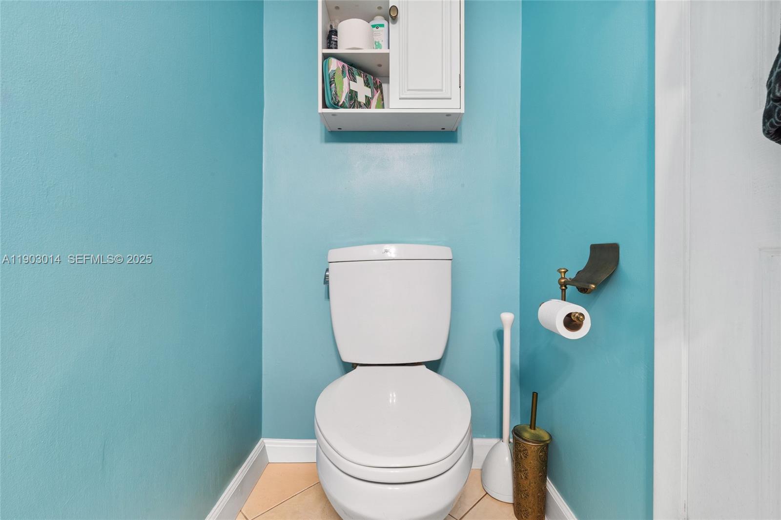 7144 West 2nd Lane Hialeah, FL 33014 - Photo 11 of 40 a bathroom with a toilet and a sink